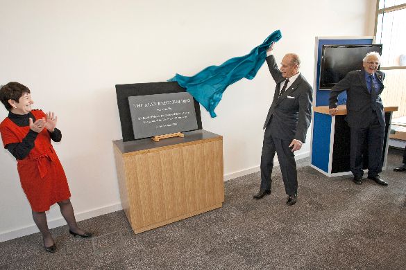 19 November 2009: the Duke of Edinburgh unveils the plaque at the opening of the new building, applauded by Dame Alison Richard, the Vice- Chancellor of the University of Cambridge at the time.
